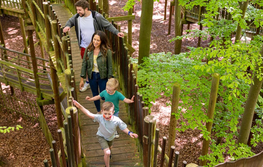 A family explore the Sky Maze in BeWILDerwood Norfolk