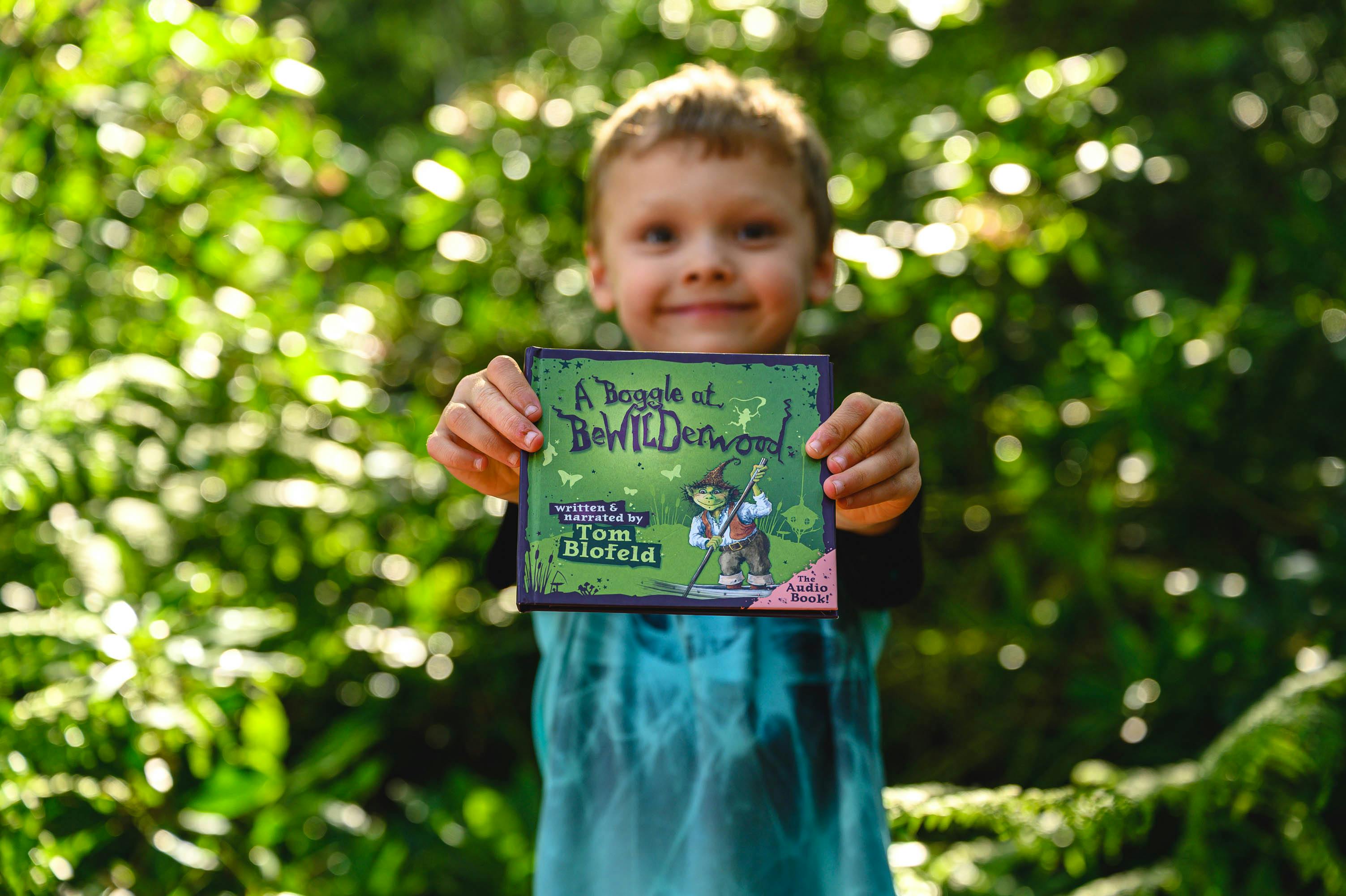 A child holds a copy of