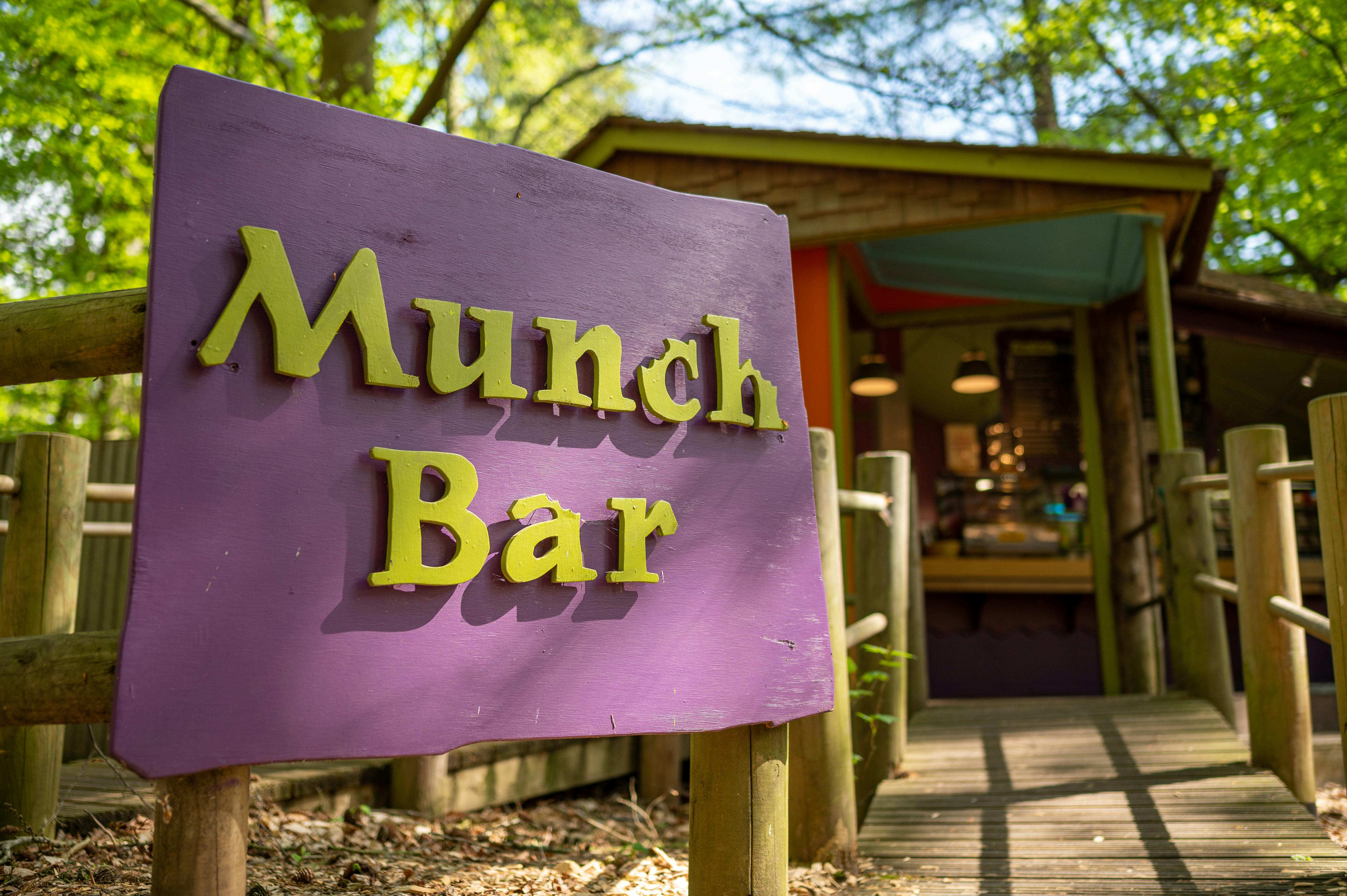 Wooden sign for Munch Bar at BeWILDerwood Norfolk